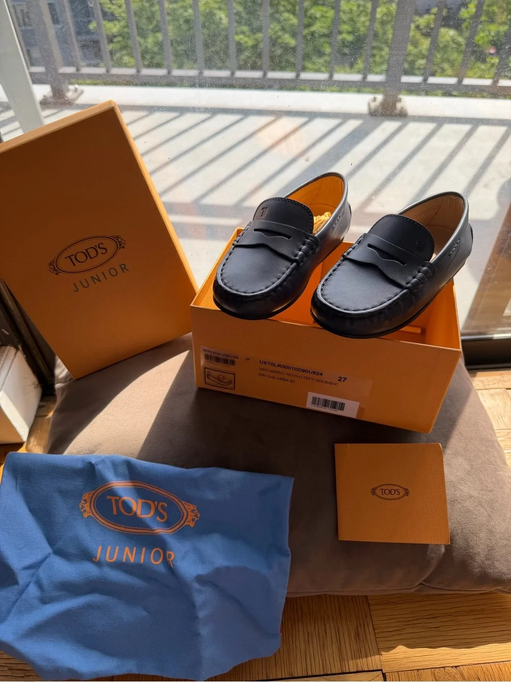 Tod's Black Leather Penny Loafers with Rubber Gommino Sole
